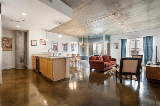 845 Spring St Unit 125, Atlanta, GA 30308 - kitchen featuring finished concrete flooring, light brown cabinetry, baseboards, light countertops, and open floor plan