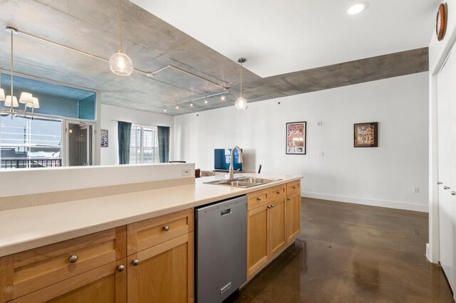 845 Spring St Unit 125, Atlanta, GA 30308 - kitchen featuring dishwasher, concrete floors, a sink, pendant lighting, and baseboards