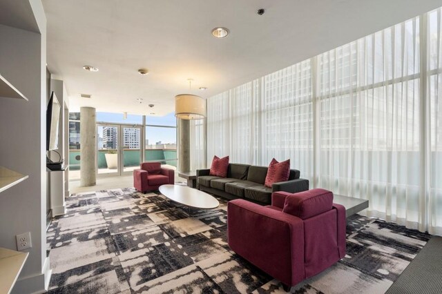845 Spring St Unit 125, Atlanta, GA 30308 - carpeted living area featuring expansive windows