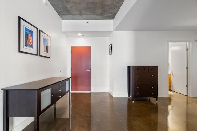 845 Spring St Unit 125, Atlanta, GA 30308 - hallway with concrete flooring and baseboards