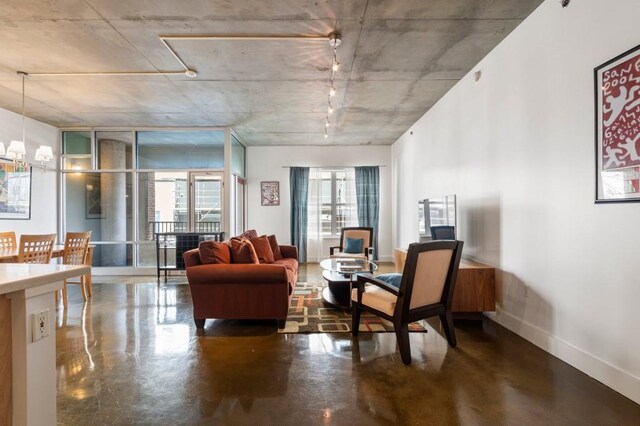 845 Spring St Unit 125, Atlanta, GA 30308 - living area with concrete flooring and baseboards