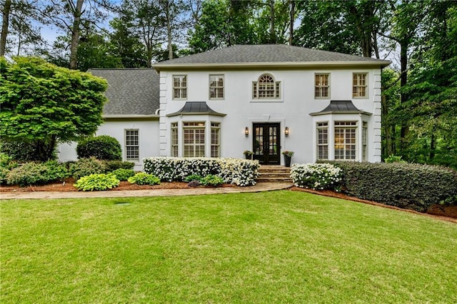 3275 Lord N Lady Ln, Alpharetta, GA 30022 - colonial-style house with french doors, a front yard, a standing seam roof, and stucco siding