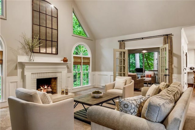 3275 Lord N Lady Ln, Alpharetta, GA 30022 - living area with a decorative wall, high vaulted ceiling, a wainscoted wall, a fireplace, and carpet