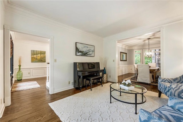 3275 Lord N Lady Ln, Alpharetta, GA 30022 - living room featuring a decorative wall, ornamental molding, wood finished floors, a chandelier, and a wainscoted wall