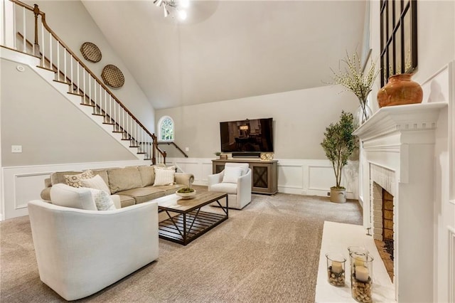 3275 Lord N Lady Ln, Alpharetta, GA 30022 - living room with carpet, stairs, a decorative wall, a ceiling fan, and high vaulted ceiling