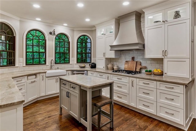 3275 Lord N Lady Ln, Alpharetta, GA 30022 - kitchen featuring a sink, custom exhaust hood, stainless steel appliances, ornamental molding, and light stone countertops