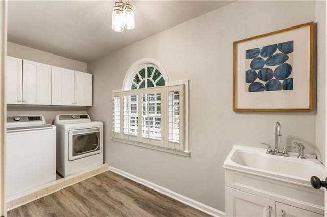 3275 Lord N Lady Ln, Alpharetta, GA 30022 - laundry room featuring separate washer and dryer, dark wood-type flooring, baseboards, and cabinet space