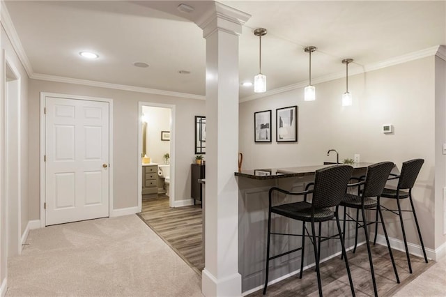 3275 Lord N Lady Ln, Alpharetta, GA 30022 - indoor wet bar featuring baseboards, pendant lighting, crown molding, carpet, and decorative columns