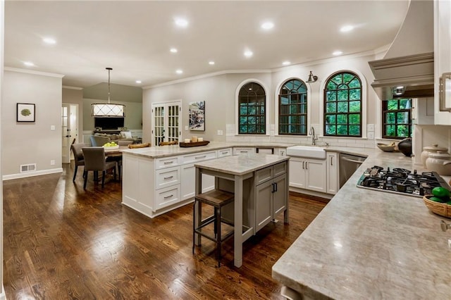 3275 Lord N Lady Ln, Alpharetta, GA 30022 - kitchen featuring crown molding, appliances with stainless steel finishes, a kitchen island, decorative backsplash, and recessed lighting