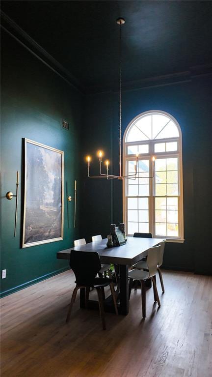 dining space with wood finished floors