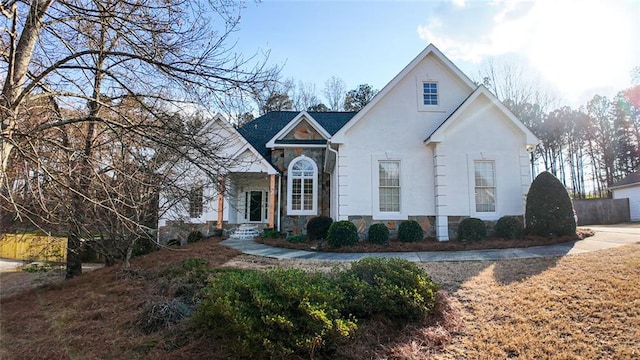 view of front of house with stone siding and stucco siding