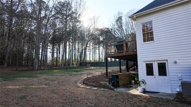 view of yard with a wooden deck and cooling unit