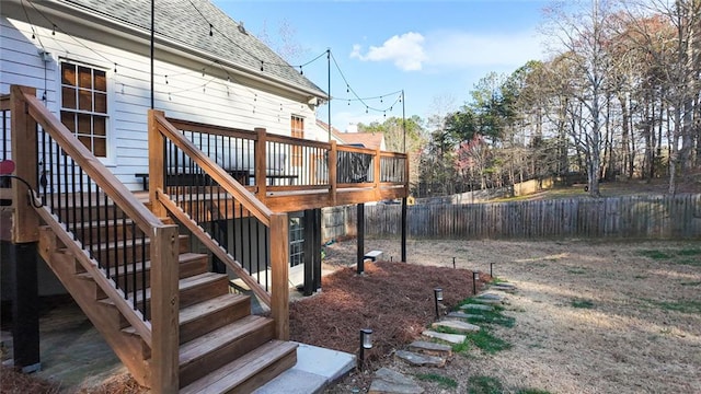 exterior space with stairway, fence, and a wooden deck