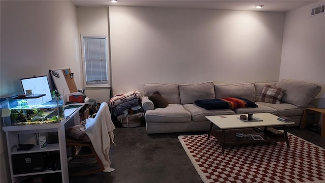 living area featuring visible vents and carpet flooring