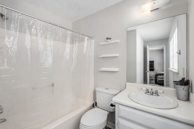 full bathroom with vanity, toilet, and shower / tub combo with curtain