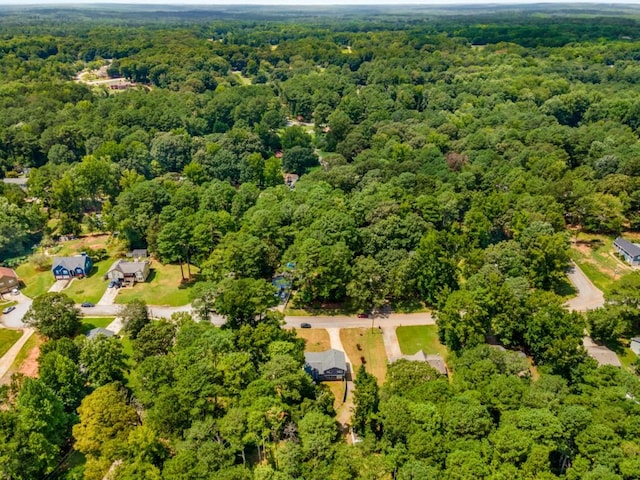 drone / aerial view featuring a forest view