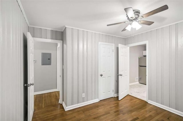 unfurnished bedroom with ceiling fan, crown molding, dark wood-type flooring, and stainless steel refrigerator