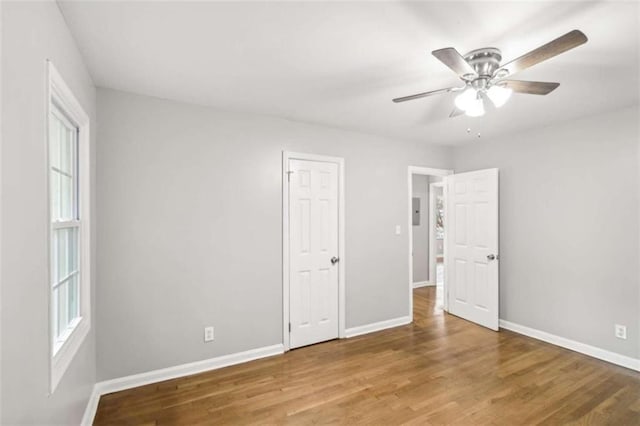 unfurnished room featuring hardwood / wood-style flooring and ceiling fan