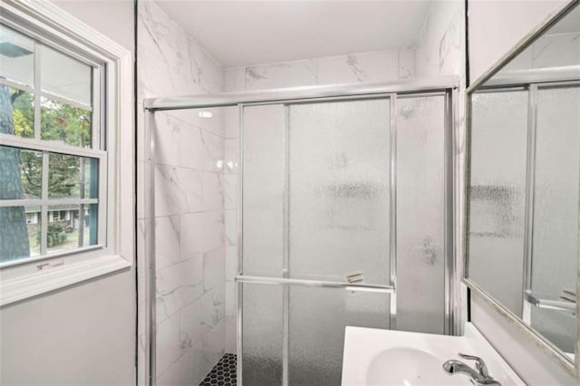 bathroom featuring vanity and walk in shower