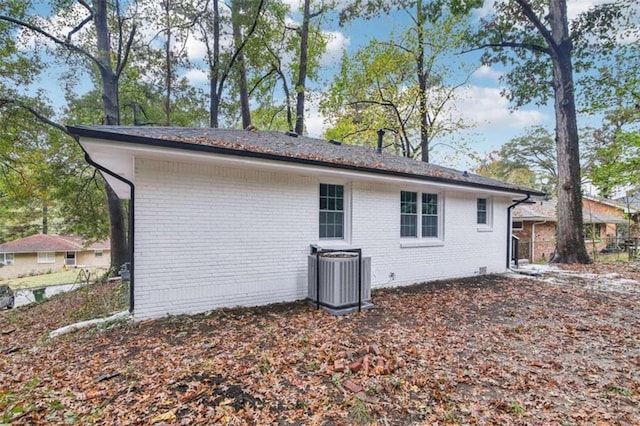 view of side of property with central AC unit