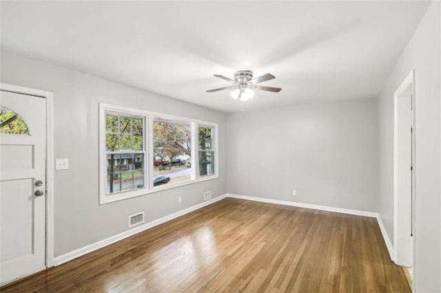 interior space with wood-type flooring, plenty of natural light, and ceiling fan