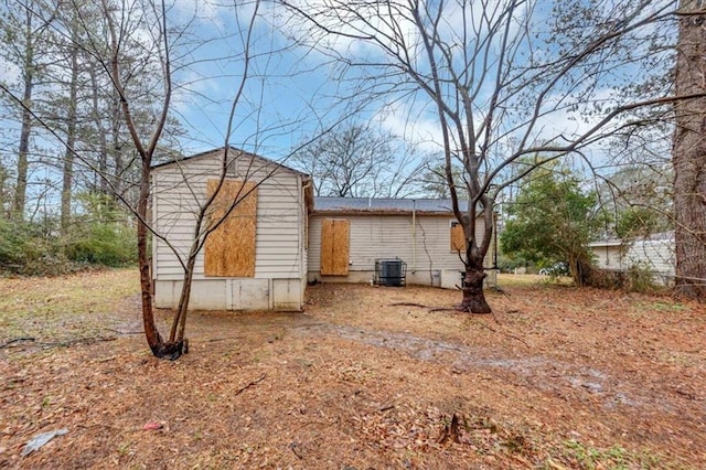 view of side of property with central AC unit