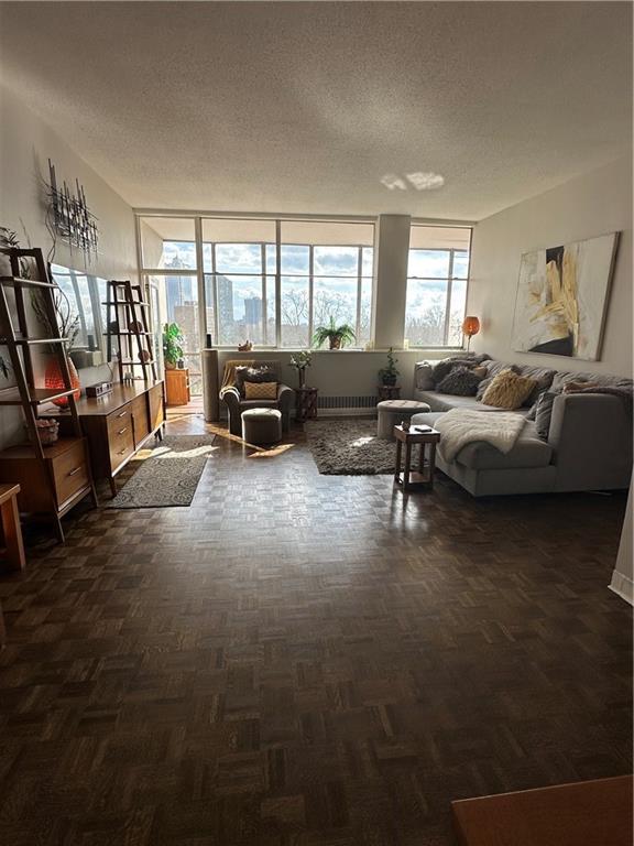 sitting room featuring dark parquet floors