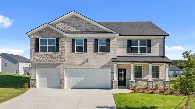 2939 Champions Way, Loganville, GA 30052 - craftsman house with a porch, a front yard, concrete driveway, and an attached garage