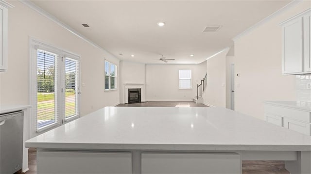 2939 Champions Way, Loganville, GA 30052 - kitchen featuring dishwasher, a ceiling fan, white cabinets, recessed lighting, and a center island