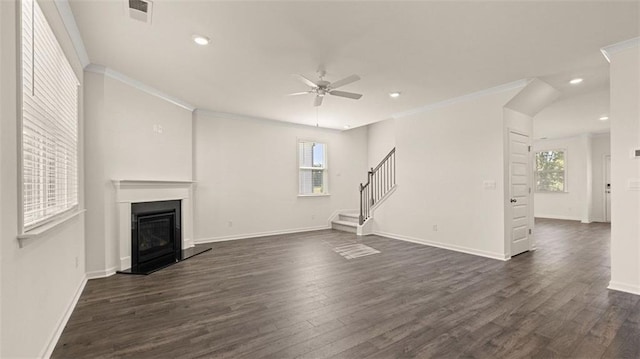 2939 Champions Way, Loganville, GA 30052 - unfurnished living room with a ceiling fan, healthy amount of natural light, dark wood-style floors, crown molding, and stairs