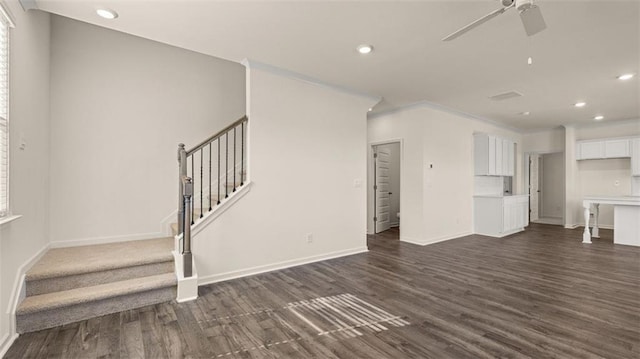 2939 Champions Way, Loganville, GA 30052 - unfurnished living room featuring recessed lighting, dark wood finished floors, a ceiling fan, stairway, and ornamental molding