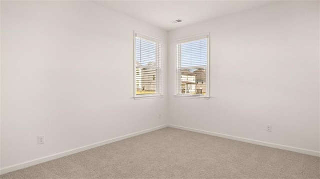 2939 Champions Way, Loganville, GA 30052 - spare room with baseboards and light colored carpet