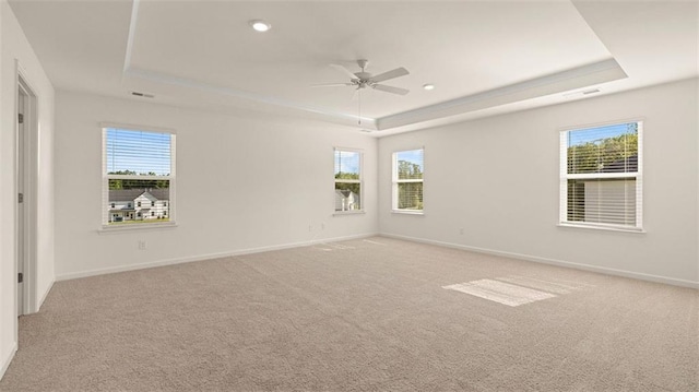 2939 Champions Way, Loganville, GA 30052 - empty room with a raised ceiling, light carpet, ceiling fan, plenty of natural light, and recessed lighting