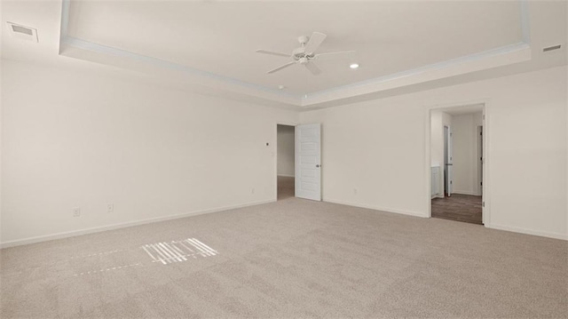 2939 Champions Way, Loganville, GA 30052 - spare room with a raised ceiling, carpet flooring, ceiling fan, and recessed lighting