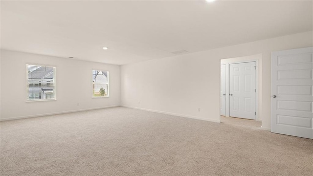 2939 Champions Way, Loganville, GA 30052 - empty room with light colored carpet and recessed lighting