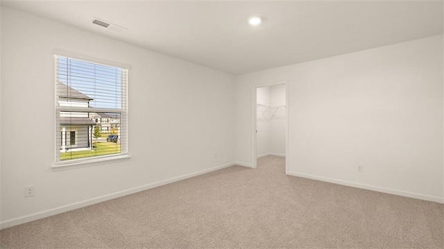 2939 Champions Way, Loganville, GA 30052 - empty room with light colored carpet and recessed lighting
