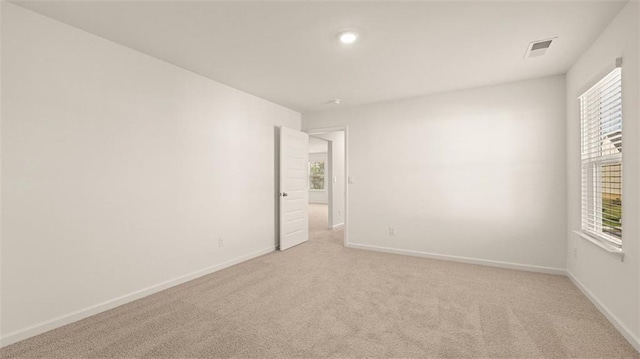 2939 Champions Way, Loganville, GA 30052 - empty room featuring light colored carpet, healthy amount of natural light, and recessed lighting