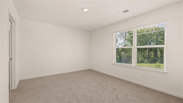 2939 Champions Way, Loganville, GA 30052 - spare room featuring carpet flooring and baseboards