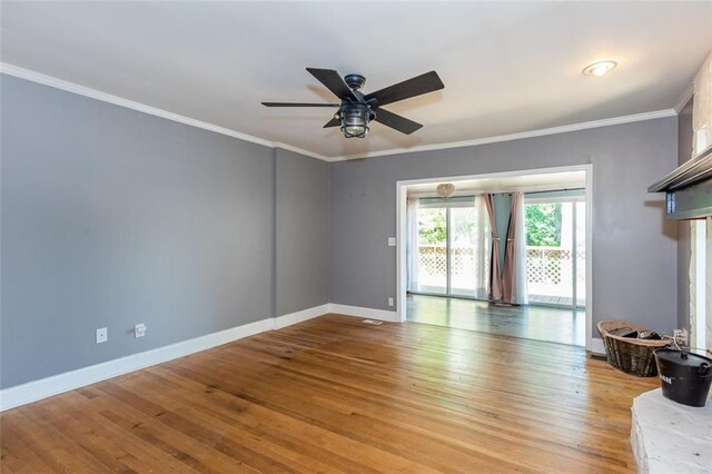 unfurnished living room featuring ceiling fan, baseboards, ornamental molding, and light wood-style floors