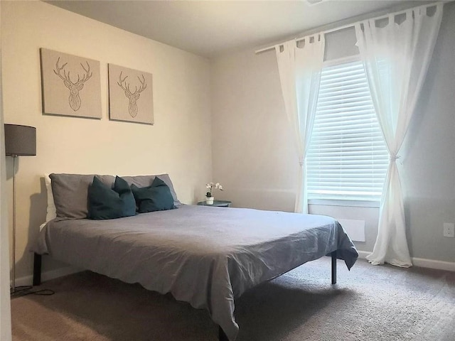 carpeted bedroom with baseboards