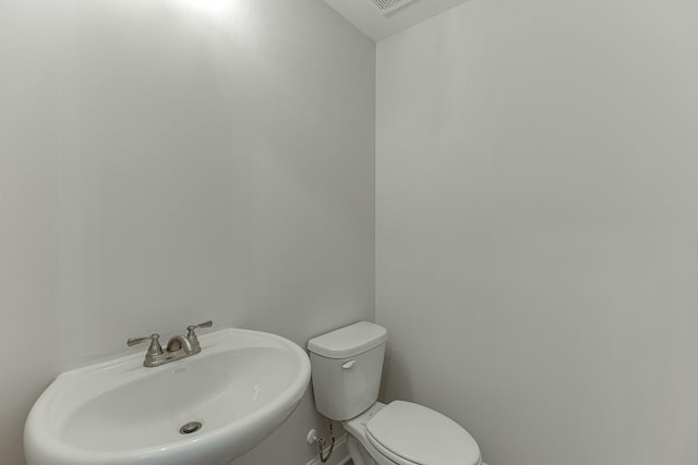 bathroom with toilet and sink