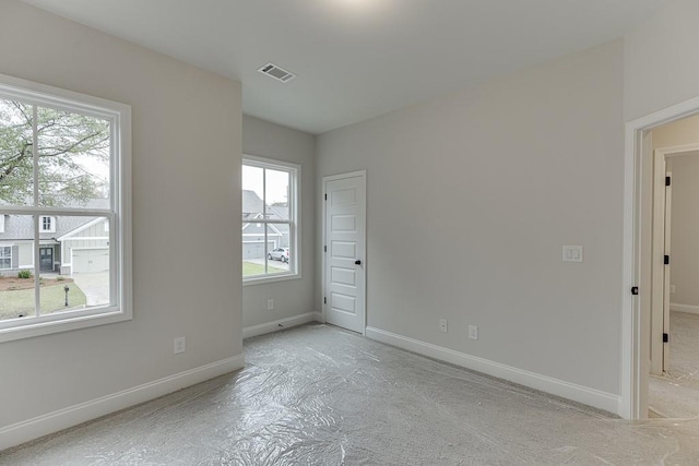 empty room featuring a wealth of natural light