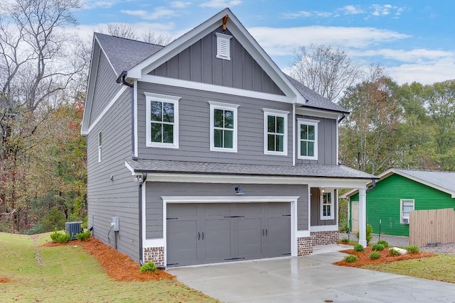 view of front of house featuring cooling unit and a garage