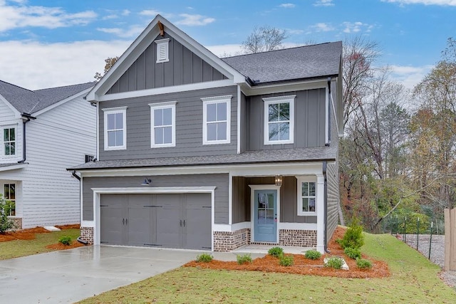 view of front facade featuring a garage and a front lawn