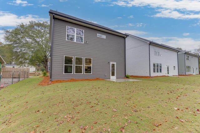 back of house featuring a yard