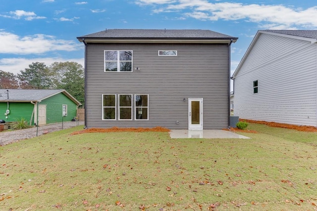 back of house featuring a patio, central AC unit, and a lawn