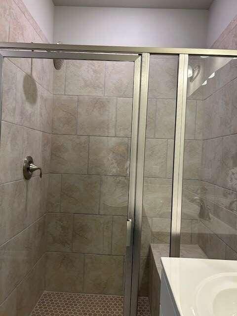 bathroom with vanity and walk in shower