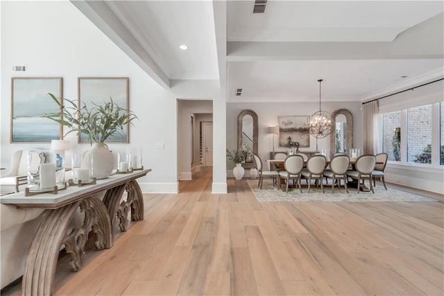 entrance foyer with a chandelier, light wood finished floors, baseboards, ornamental molding, and recessed lighting