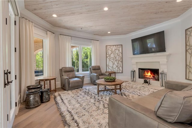living room featuring wood ceiling, wood finished floors, a fireplace with flush hearth, crown molding, and recessed lighting