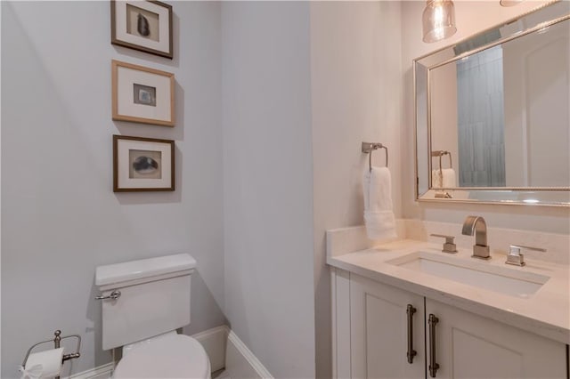 bathroom with toilet and vanity